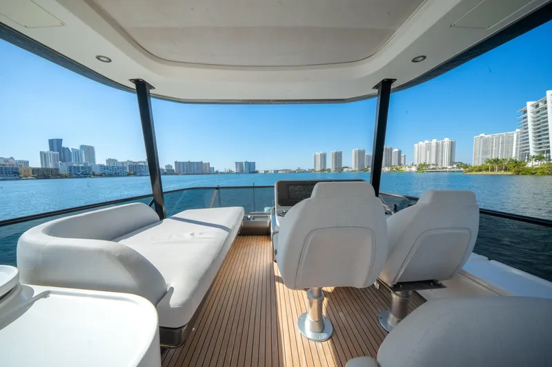 Slide: The Image of Luxurious 2023 Azimut Fly 68 yacht interior with waterfront cityscape view. - 42
