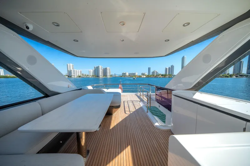 Slide: The Image of Luxurious 2023 Azimut Fly 68 yacht deck with city skyline view. - 43
