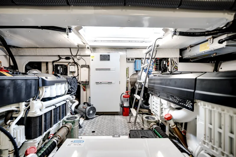 Slide: The Image of Engine room of 2023 Azimut Fly 68 yacht, featuring advanced machinery and equipment. - 48