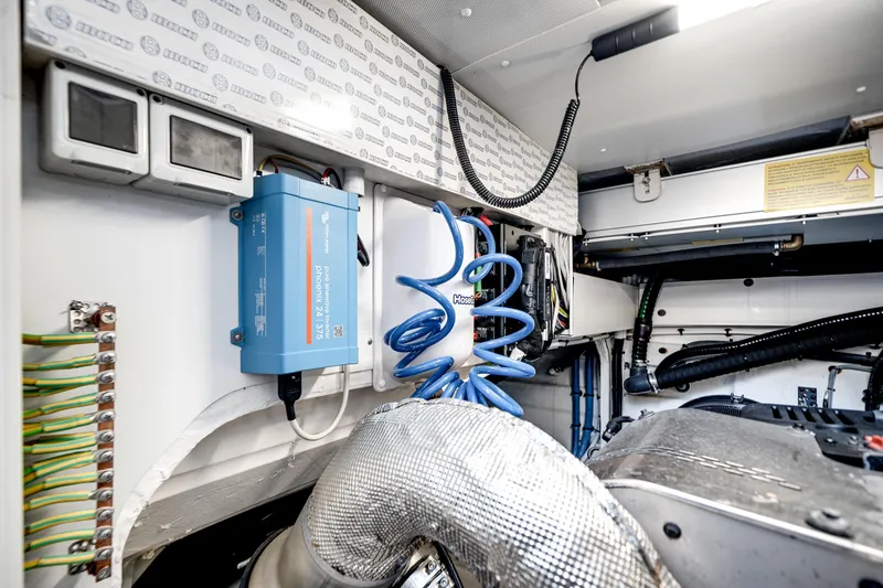 Slide: The Image of Engine room of 2023 Azimut Fly 68 yacht, showcasing electrical components and wiring. - 51