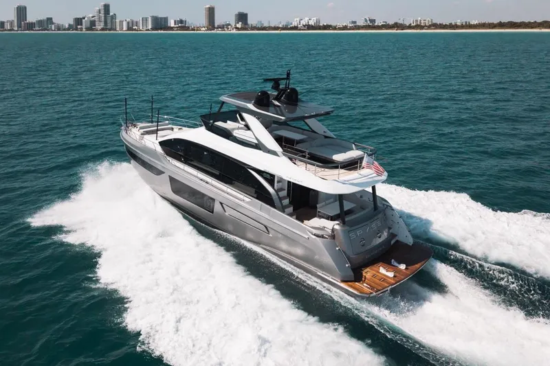 Slide: The Image of 2023 Azimut Fly 68 yacht cruising on ocean near city skyline. - 62