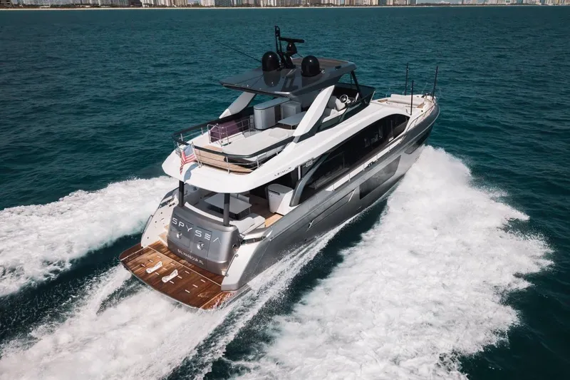 Slide: The Image of 2023 Azimut Fly 68 yacht cruising on open water, rear view. - 66