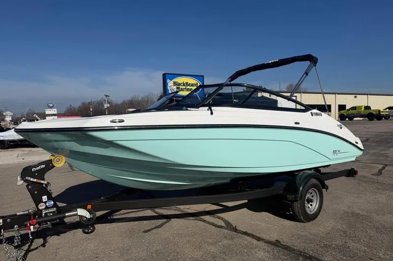 The Image of 2026 Yamaha Boats SX195 on trailer at BlackBeard Marine dealership. - 0