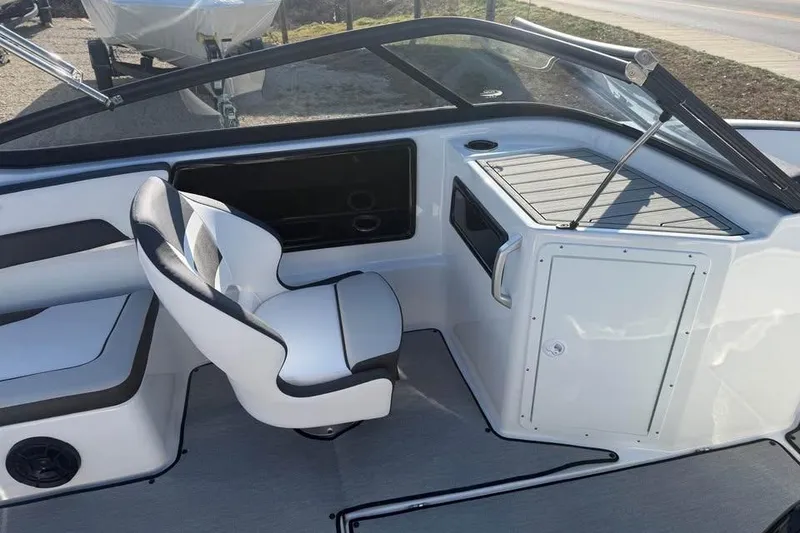 Slide: The Image of 2026 Yamaha Boats SX195 interior with sleek seating and modern dashboard design. - 10