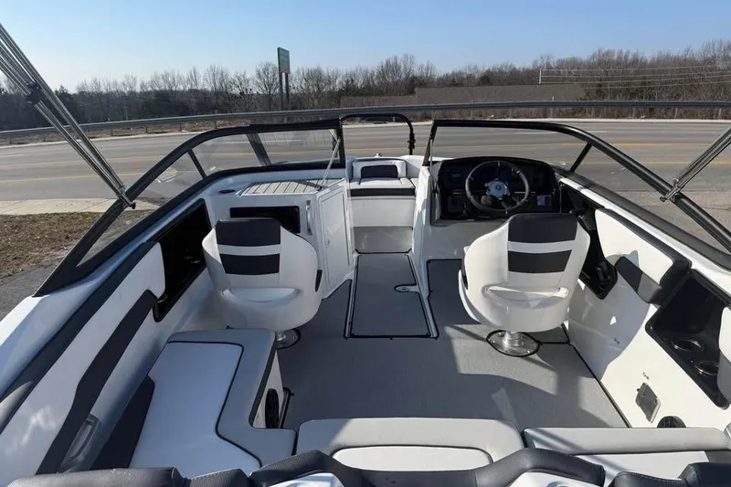 Slide: The Image of 2026 Yamaha Boats SX195 interior with modern seating and steering wheel. - 7