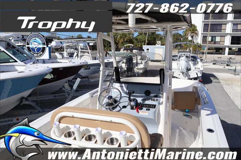 Slide: The Image of 2026 Bayliner Trophy T22CC boat at Antonietti Marine dealership, showcasing console and seating. - 11