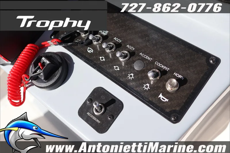 Slide: The Image of Control panel of 2026 Bayliner Trophy T22CC boat with switches and ignition. - 15