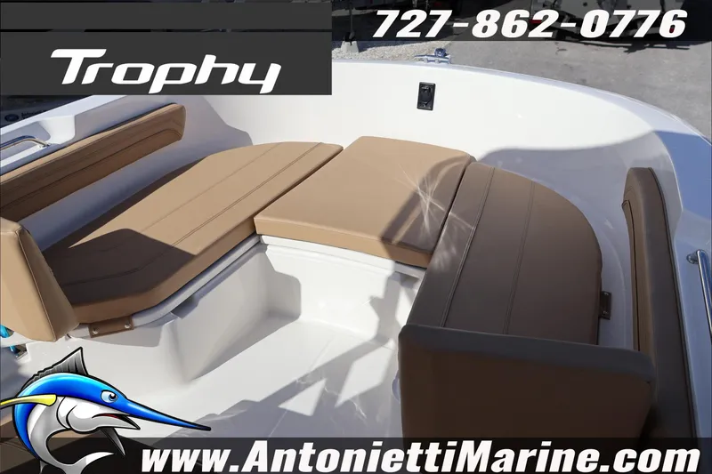 Slide: The Image of Interior seating of 2026 Bayliner Trophy T22CC boat with tan cushions. - 18