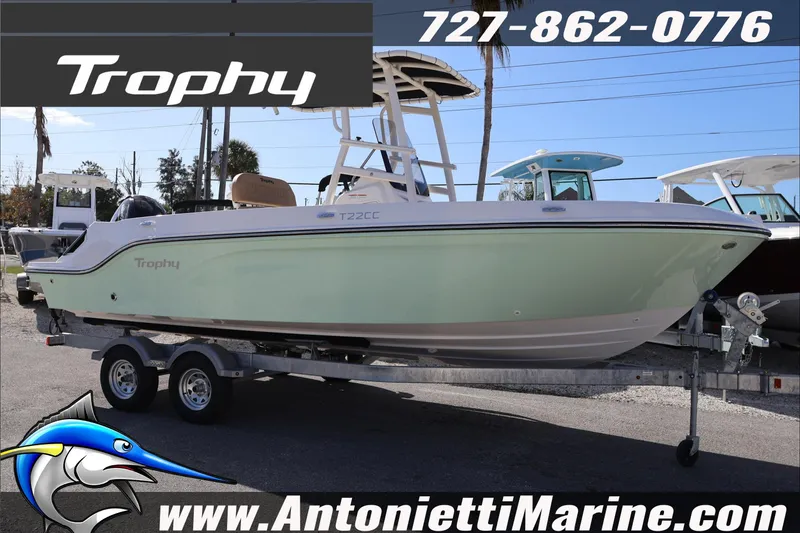 The Image of 2026 Bayliner Trophy T22CC boat on trailer at Antonietti Marine dealership. - 2