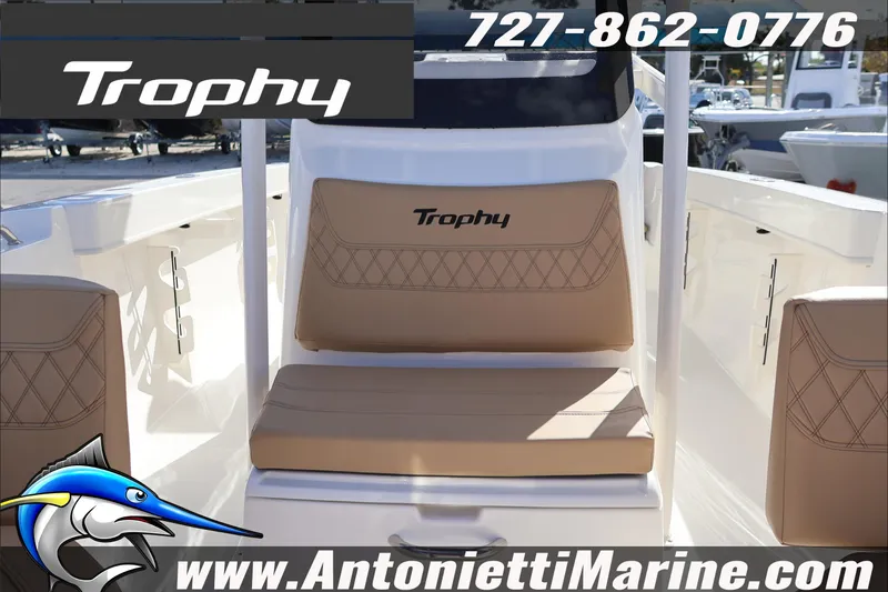 Slide: The Image of 2026 Bayliner Trophy T22CC boat interior with tan seating, Antonietti Marine branding. - 20