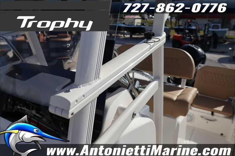 Slide: The Image of 2026 Bayliner Trophy T22CC boat interior with seating and steering console. - 22