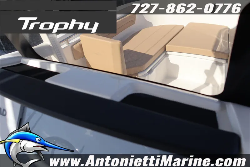 Slide: The Image of 2026 Bayliner Trophy T22CC boat interior with tan seating, Antonietti Marine branding. - 31