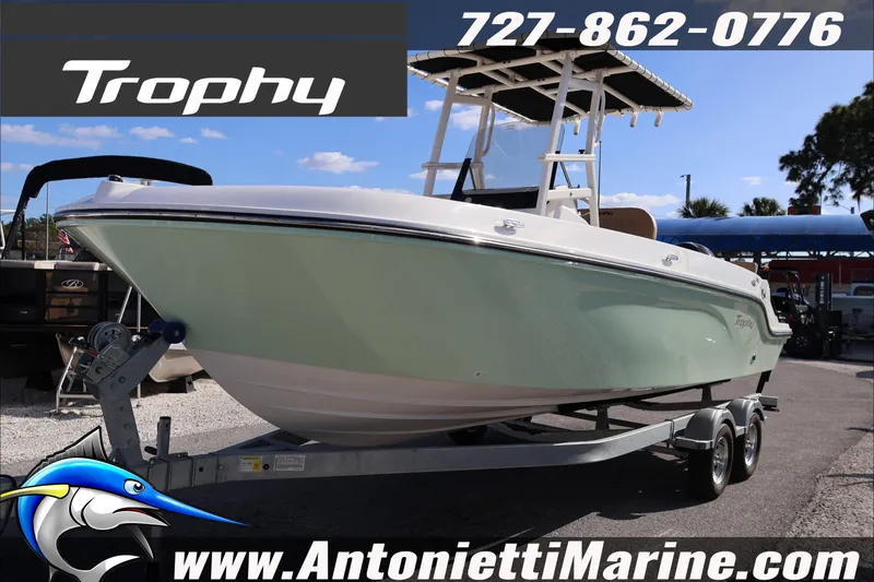 Slide: The Image of 2026 Bayliner Trophy T22CC boat on trailer at Antonietti Marine dealership. - 4