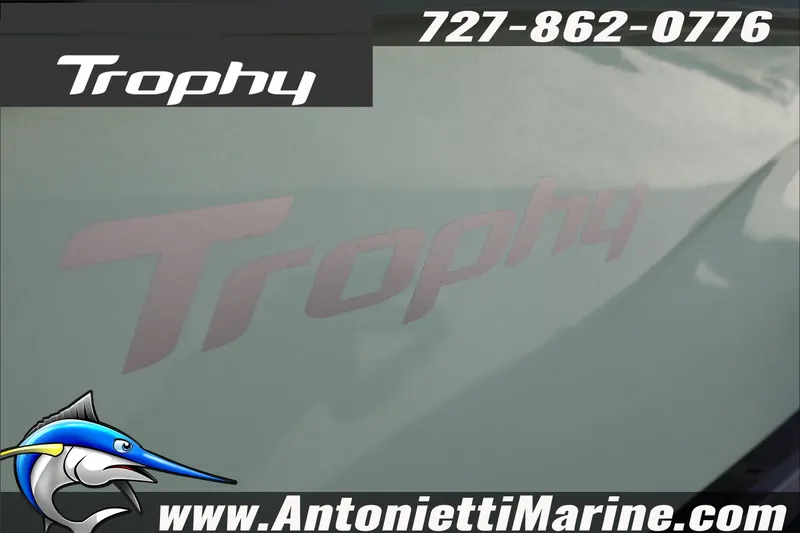 Slide: The Image of 2026 Bayliner Trophy T22CC boat advertisement with contact details and website. - 7