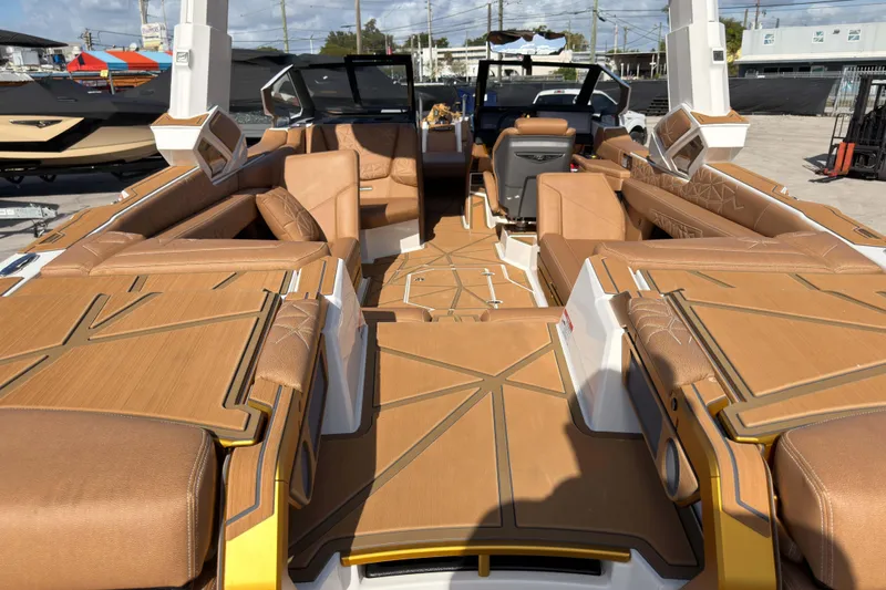 Slide: The Image of 2025 Nautique Super Air Nautique G25 Paragon interior with luxurious tan seating and modern design. - 16
