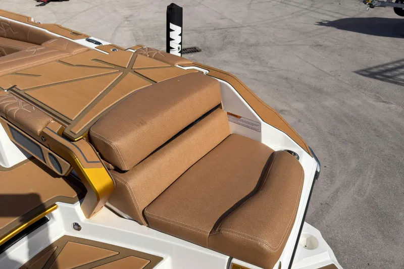 Slide: The Image of 2025 Nautique Super Air Nautique G25 Paragon boat with tan seating and deck details. - 17