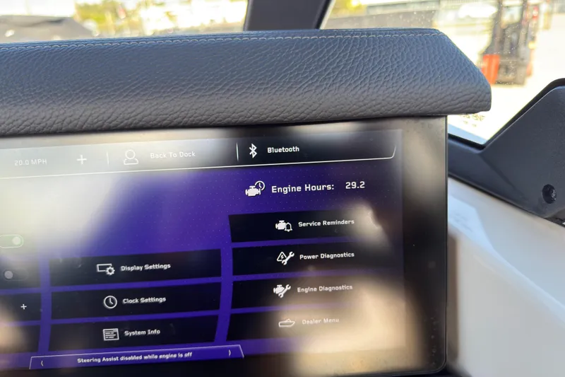 Slide: The Image of 2025 Nautique Super Air Nautique G25 Paragon dashboard displaying engine hours and settings. - 5