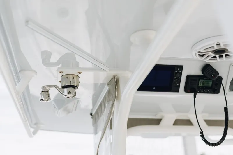 Slide: The Image of 2023 Yellowfin 32 Offshore boat interior with radio and speaker system. - 10