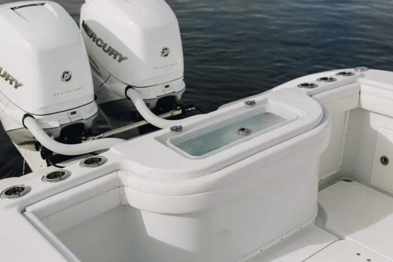 Slide: The Image of 2023 Yellowfin 32 Offshore boat with dual Mercury engines, featuring a sleek white design. - 13