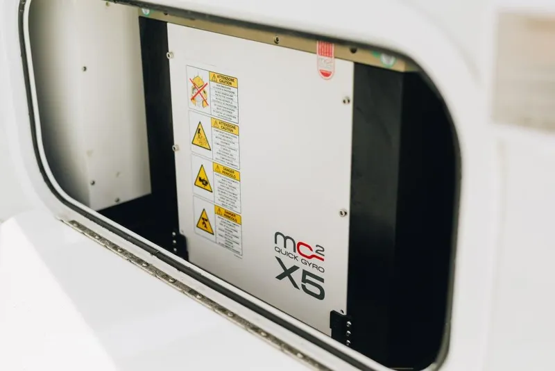 Slide: The Image of MC² Quick Gyro X5 in 2023 Yellowfin 32 Offshore boat compartment. - 14