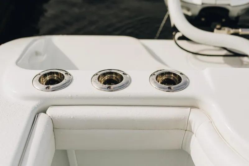 Slide: The Image of 2023 Yellowfin 32 Offshore boat rod holders on white deck. - 16