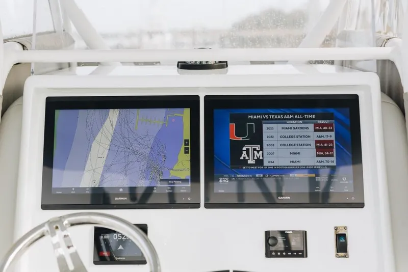 Slide: The Image of Dashboard of 2023 Yellowfin 32 Offshore with dual Garmin displays showing navigation and sports data. - 7