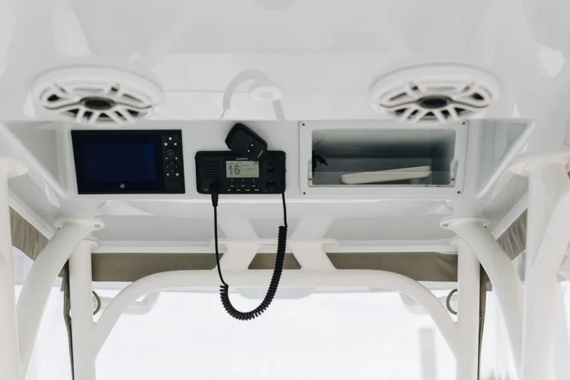 Slide: The Image of 2023 Yellowfin 32 Offshore boat console with speakers and navigation equipment. - 9
