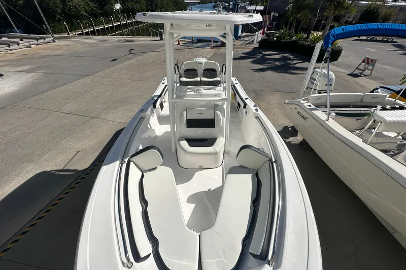Slide: The Image of 2025 Tidewater 198 CC Adventure boat, white interior, docked at marina. - 12