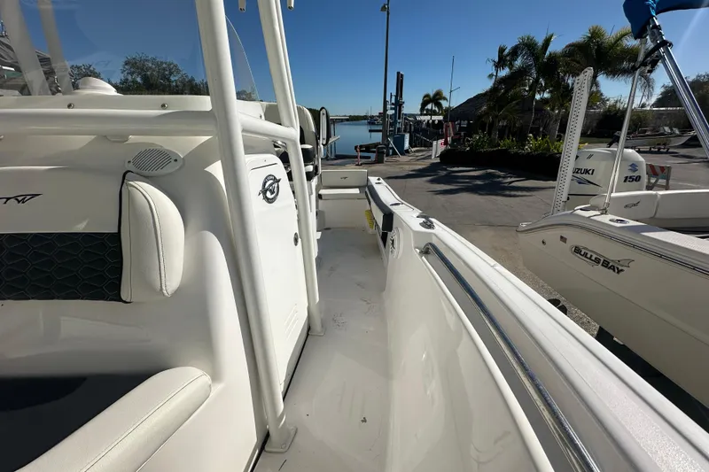 Slide: The Image of 2025 Tidewater 198 CC Adventure boat docked, showcasing sleek design and spacious interior. - 16