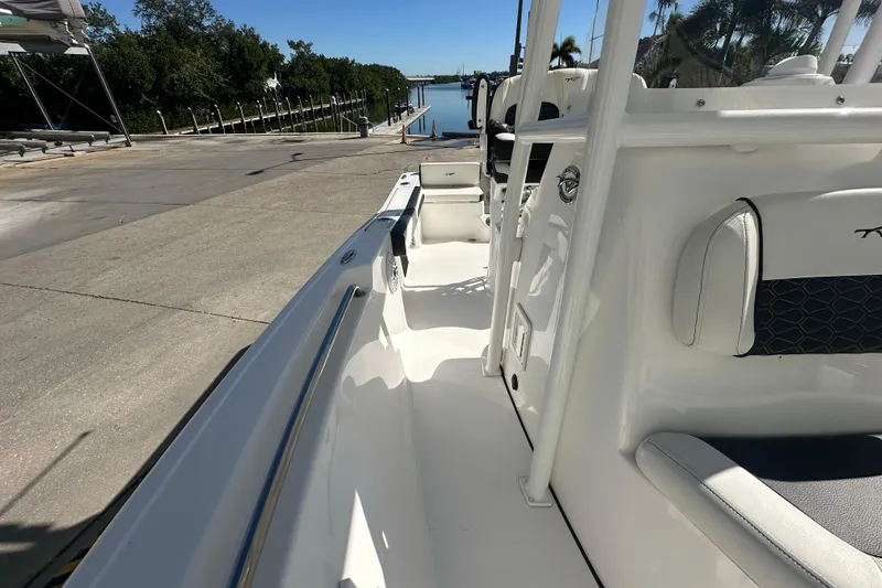 Slide: The Image of 2025 Tidewater 198 CC Adventure boat at dockside, showcasing sleek interior design. - 17