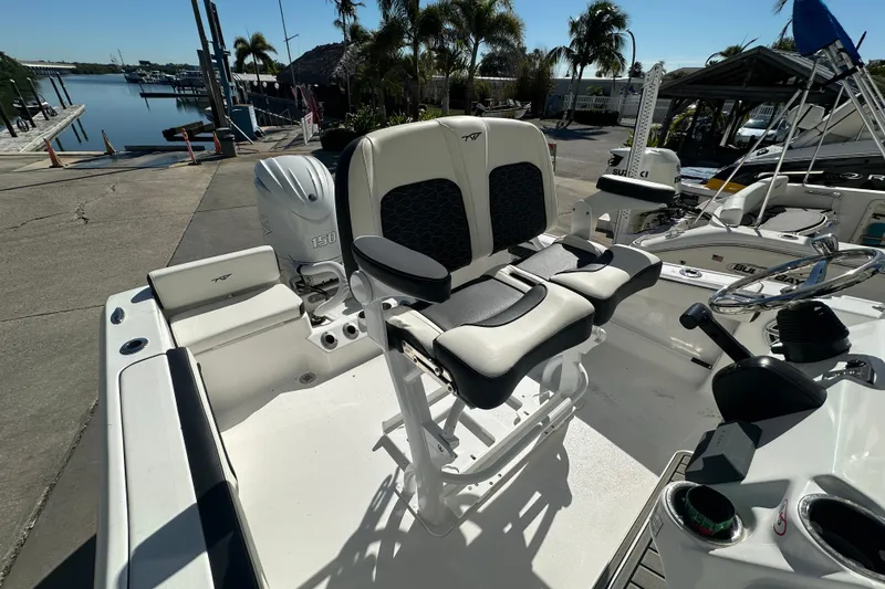 Slide: The Image of 2025 Tidewater 198 CC Adventure boat interior with dual seats and Yamaha 150 engine. - 18