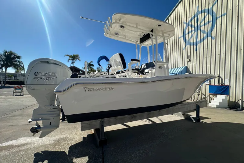 Slide: The Image of 2025 Tidewater 198 CC Adventure boat with Yamaha engine on display outdoors. - 2