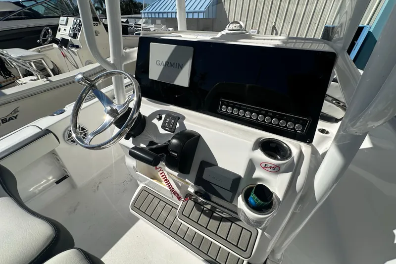 Slide: The Image of 2025 Tidewater 198 CC Adventure boat dashboard with Garmin navigation system. - 24