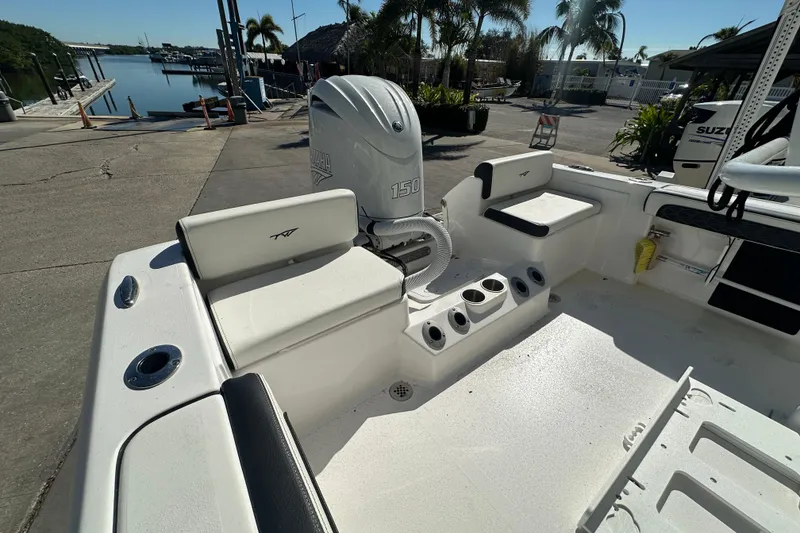 Slide: The Image of 2025 Tidewater 198 CC Adventure boat interior with Yamaha 150 engine at marina. - 25