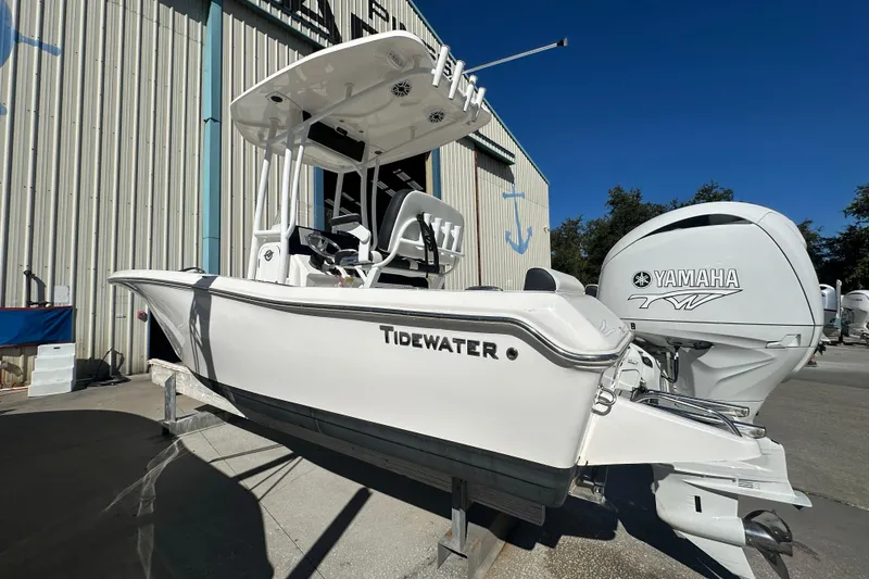 Slide: The Image of 2025 Tidewater 198 CC Adventure boat with Yamaha engine, displayed outdoors. - 5