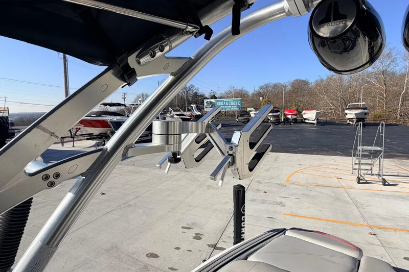 Slide: The Image of 2015 MasterCraft X20 boat with wakeboard tower and speakers in a marina setting. - 17