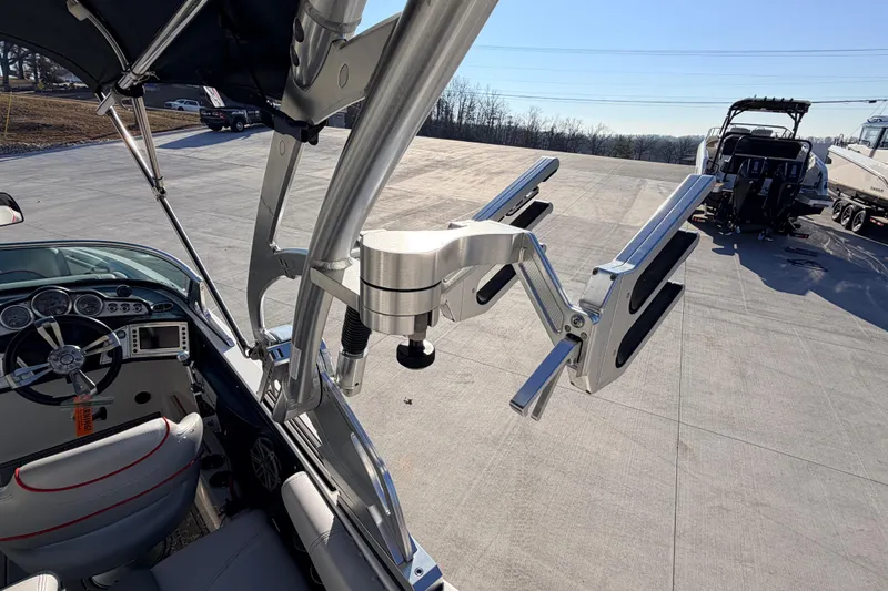 Slide: The Image of 2015 MasterCraft X20 boat interior with steering wheel and wakeboard rack. - 20