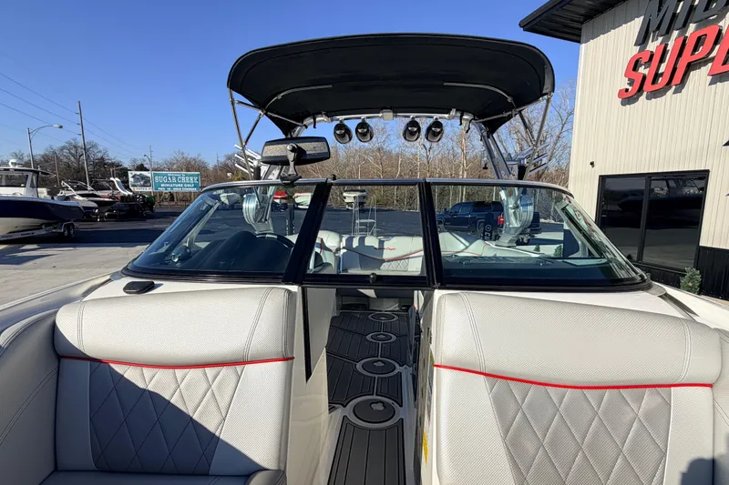 Slide: The Image of 2015 MasterCraft X20 boat with sleek interior and modern design features. - 26