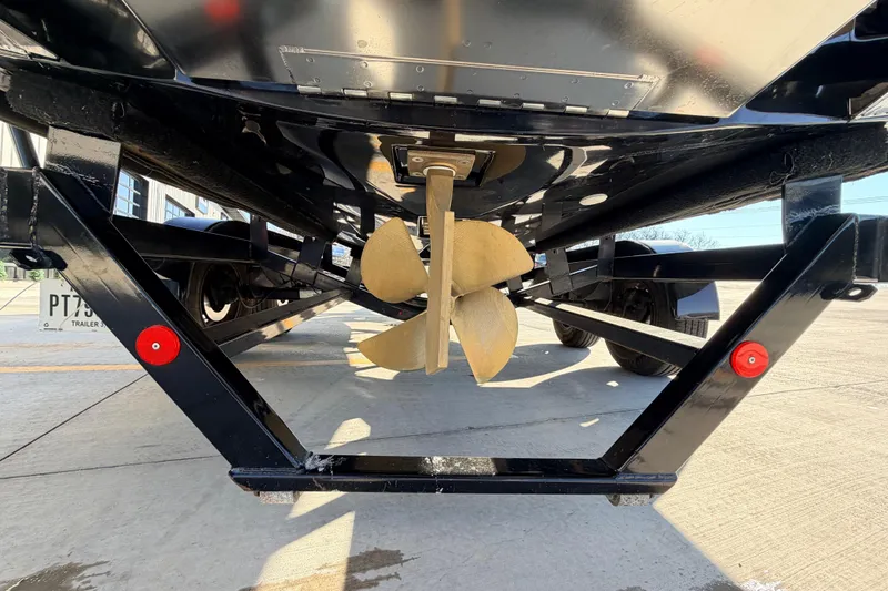 Slide: The Image of 2015 MasterCraft X20 boat propeller and trailer underside view. - 34