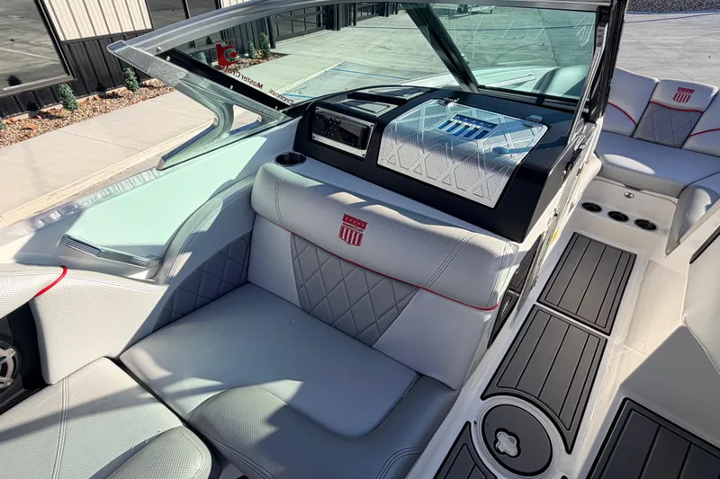 Slide: The Image of 2015 MasterCraft X20 boat interior with luxurious seating and modern dashboard design. - 43