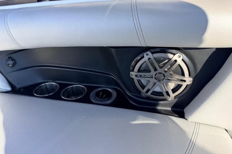 Slide: The Image of 2015 MasterCraft X20 interior with JL Audio speaker and cup holders. - 8