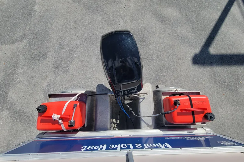 Slide: The Image of Top view of 2015 Sun Tracker Party Barge 16 DLX with dual red fuel tanks. - 12