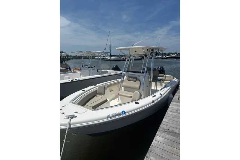 The Image of 2024 Key West 239 FS boat docked by the waterfront under a clear sky. - 1