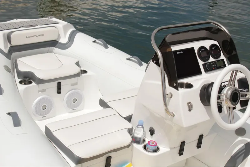 Slide: The Image of Manufacturer Provided Image: 2025 Walker Bay Venture 14 boat interior with sleek design and modern dashboard. - 14