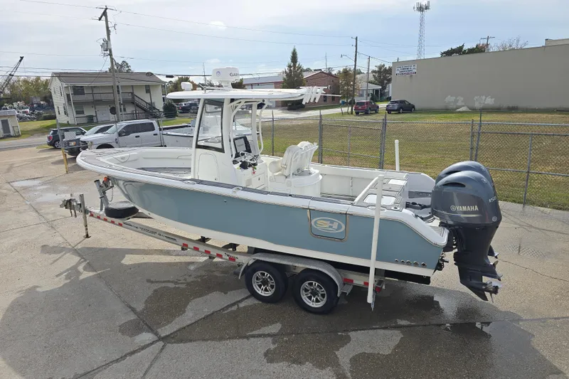 Slide: The Image of 2019 Sea Hunt Gamefish 25 boat on trailer, featuring Yamaha outboard motor. - 14