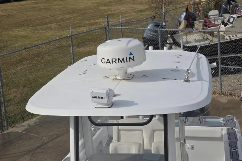 Slide: The Image of 2019 Sea Hunt Gamefish 25 boat with Garmin radar and Golight spotlight on top. - 18