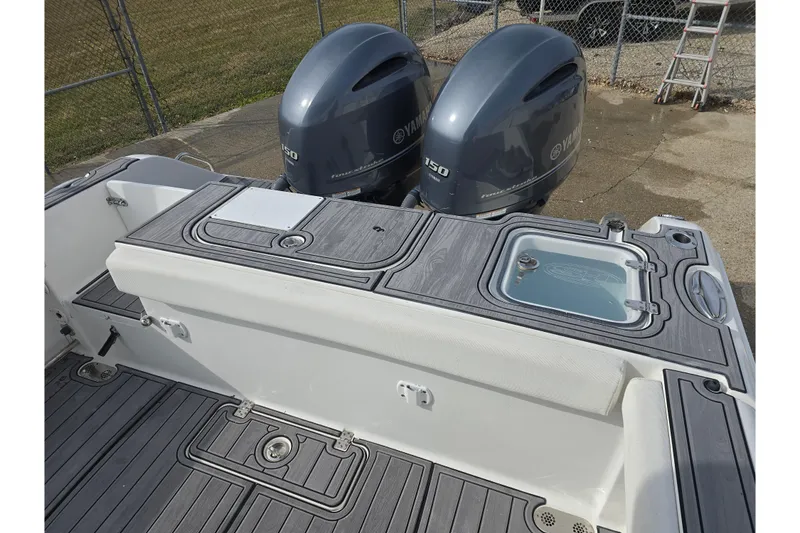 Slide: The Image of 2019 Sea Hunt Gamefish 25 boat with dual Yamaha 150 engines and deck storage. - 22