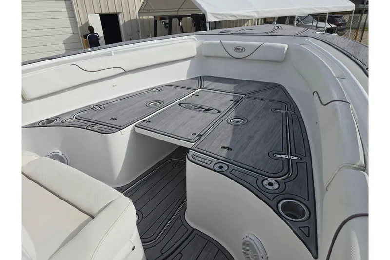Slide: The Image of 2019 Sea Hunt Gamefish 25 boat interior with sleek seating and storage compartments. - 24