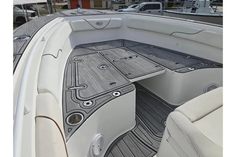 Slide: The Image of 2019 Sea Hunt Gamefish 25 boat interior with sleek seating and storage compartments. - 25