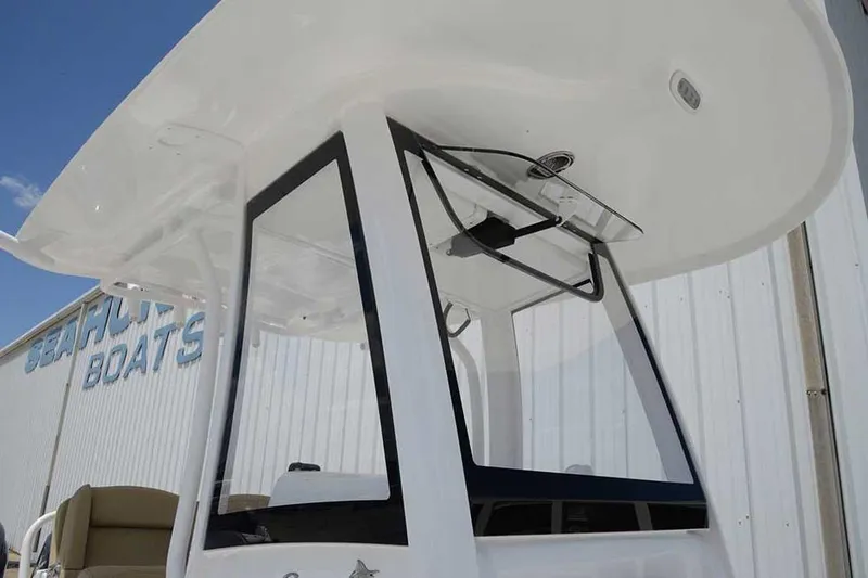 Slide: The Image of 2019 Sea Hunt Gamefish 25 boat with Garmin equipment, parked outdoors. - 7